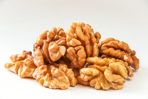 Group of Walnuts On A White Background.
